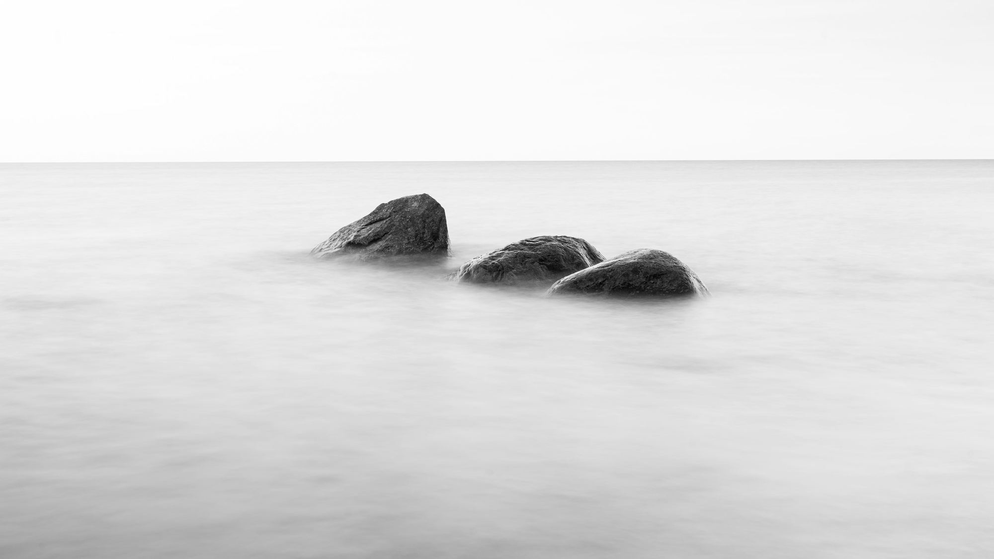 Three stones in still water